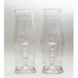 PAIR OF ENGLISH ETCHED GLASS HURRICANE SHADES AND A PAIR OF STEUBEN GLASS TEAR-DROP CANDLESTICKS