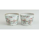 PAIR OF CHINESE FAMILLE ROSE PORCELAIN FIGURAL-PAINTED CACHE POTS