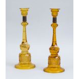 PAIR OF CUT AMBER GLASS TALL CANDLESTICKS