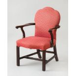 GEORGE III CARVED MAHOGANY LIBRARY ARMCHAIR
