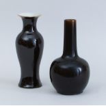 CHINESE UMBER-GLAZED PORCELAIN BOTTLE VASE AND A MIRROR BLACK-GLAZED PORCELAIN BALUSTER-FORM VASE