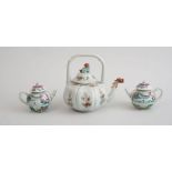 PAIR OF CHINESE EXPORT FAMILLE ROSE PORCELAIN TEAPOTS AND A SINGLE CHINESE EXPORT TEAPOT