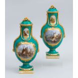 PAIR OF ENGLISH VICTORIAN PORCELAIN PICTORIAL EMERALD GREEN GROUND URNS AND COVERS