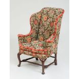 GEORGE II STYLE WALNUT WING ARMCHAIR