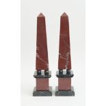 PAIR OF NEOCLASSICAL STYLE RED AND VEINED BLACK MARBLE OBELISKS