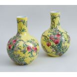 PAIR OF CHINESE YELLOW-GROUND FAMILLE ROSE PORCELAIN BOTTLE VASES