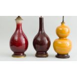 THREE CHINESE GLAZED PORCELAIN VASES, MOUNTED AS LAMPS