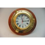 A brass, wood mounted Rickmer Rickmers ship's cloc