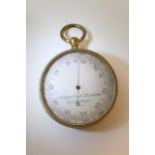 A Negretti and Zambia gilt metal pocket barometer