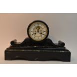 A large black and white marble mantle clock. Appro