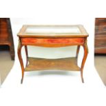 A fine 19th Century French Vitrine the bevelled edge glass surrounded by inlaid marquetry the