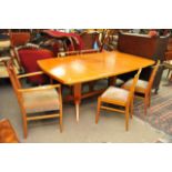 A Gordon Russel dining table six matching chairs including two carvers and a maple sideboard with