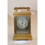 An Aiguilles four glass brass carriage clock with