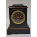 A black and rouge red marble mantle clock with pai