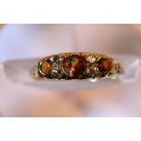 An 18ct gold diamond and amber ring