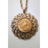 A 1908 gold full sovereign on a gold chain.