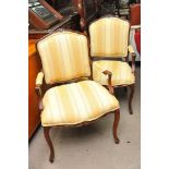 A pair of 19th Century French style open armchairs with upholstered back and seat on cabriole legs