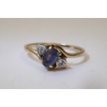 A 9ct gold ring set with a pale blue stone.