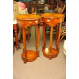 A pair of reproduction Edwardian style jardiniere stands, on serpentine legs united by an