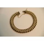 A 9ct gold bracelet with a double row of open links, hallmarks to the clasp