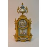 A French style ormolu clock with painted porcelain