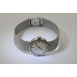 A white gold and platinum ladies watch.