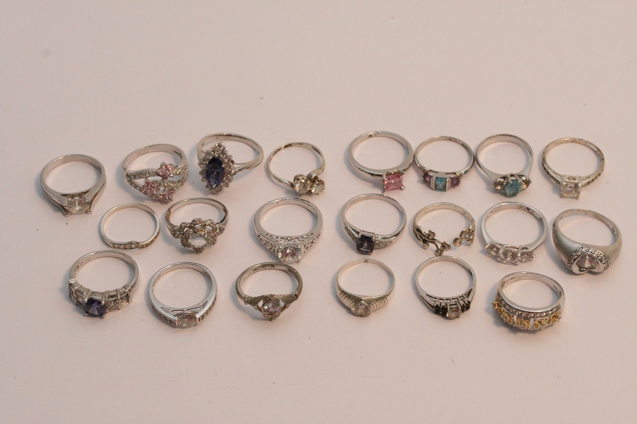 A collection of twenty various silver rings inset with coloured stones.