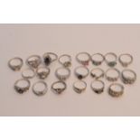 A collection of twenty various silver rings inset with coloured stones.