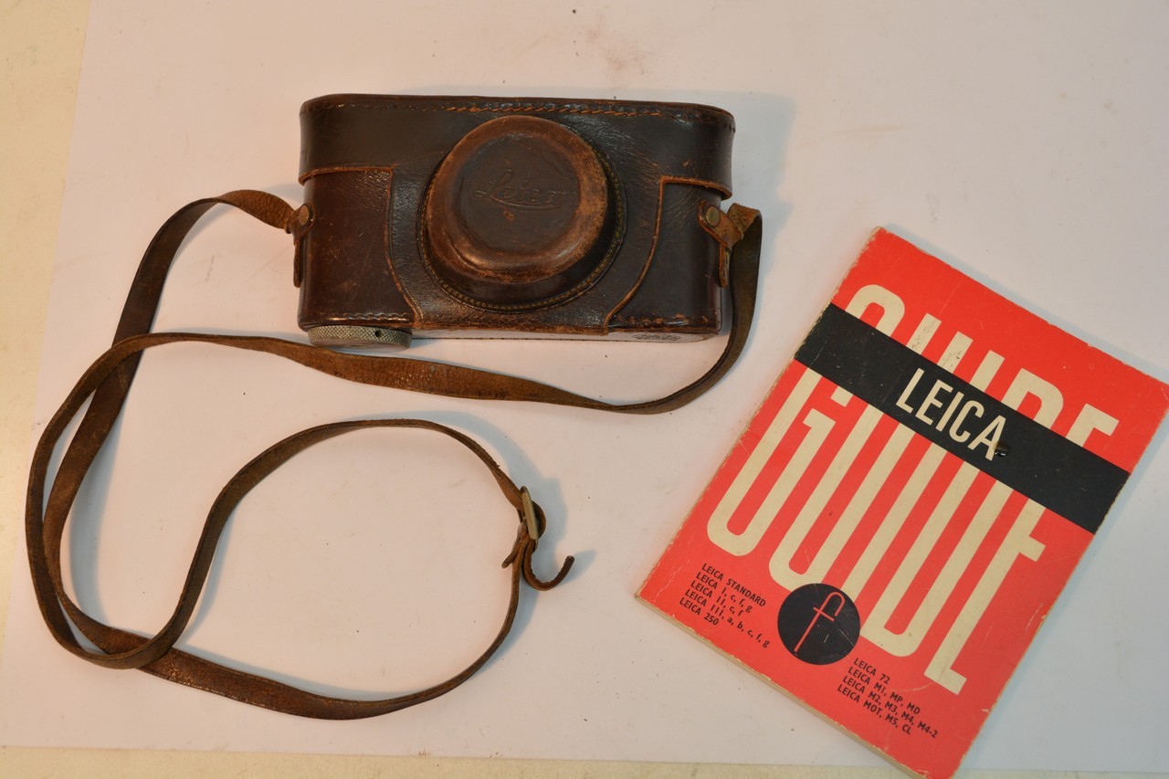 A Leica Camera D.R.P Ernest Leitz serial number 281973. In a leather case.