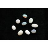 Nine small loose opal stones