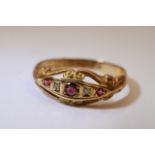 A 9ct gold ring set with garnets.