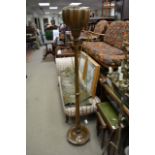 A 1920s mahogany lamp stand with a turned column