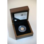 A royal mint gold quarter sovereign in certificate