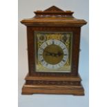 An Edwardian oak case chime mantel clock silvered