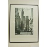 Three large framed photographs of New York.