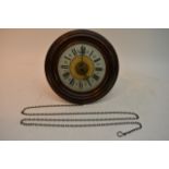 A mahogany wall clock, the dial with Roman Numeral