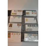 Four albums containing first day covers