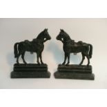 Pair of cast iron doorstops in the form of horses