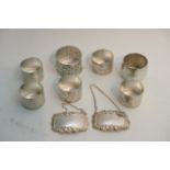 A collection of six English silver napkin rings pl