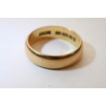 A 22ct gold wedding band.