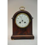 An Edwardian mahogany mantel clock the enamel dial