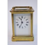 A brass cased carriage clock having enamel dial wi