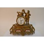 A French Gilt Mantel clock inset with porcelain pa
