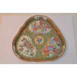 A canton scalloped edged tray decorated with figur