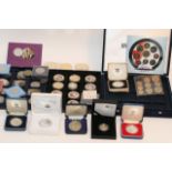 Three cases of various proof coins plus four cased