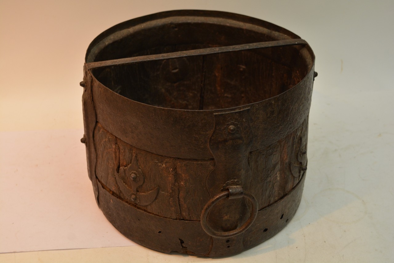 A wrought iron and wood bucket of unusual design w