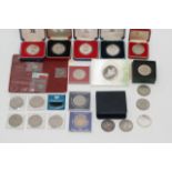 A tin of silver crowns and proof set