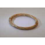 A 9ct gold simulated rope tie bracelet