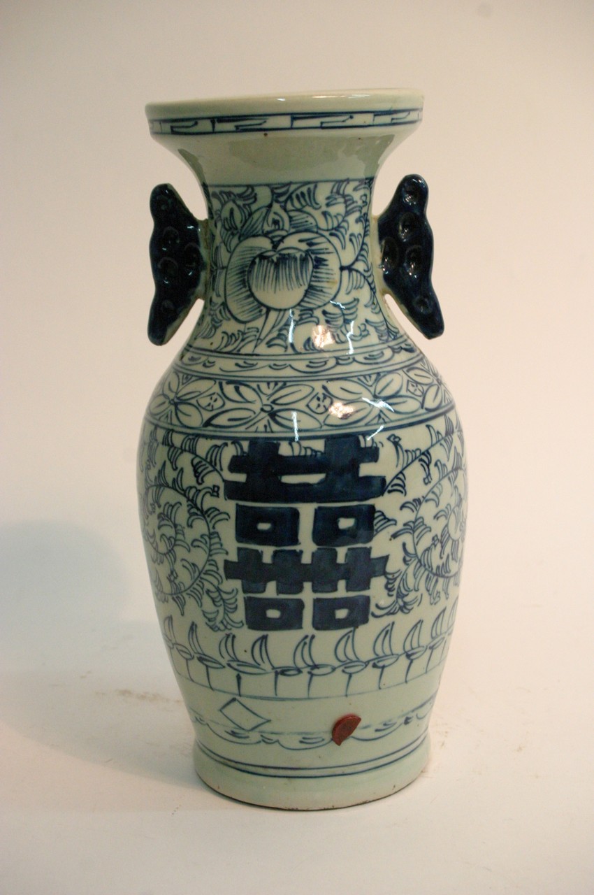 A Chinese blue and white vase with blue scrolled d