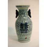 A Chinese blue and white vase with blue scrolled d